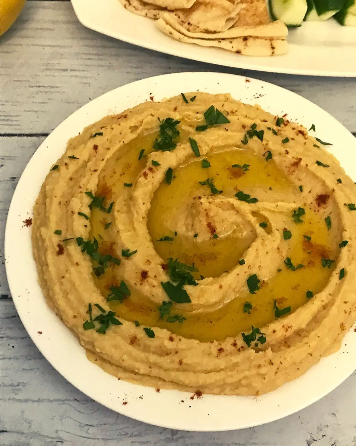 hummus without tahini served in white plate sprinkled with olive oil 